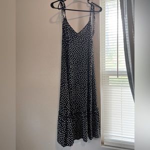 MODCLOTH | Stretchy b&w polka dotted dress w/tie up straps and ruffle bottom